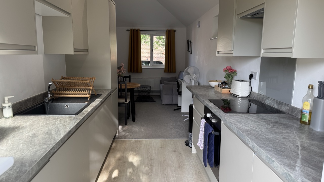 Modern apartment living room at Kaiv Residence Three Bridges Crawley with sofa bed and smart TV