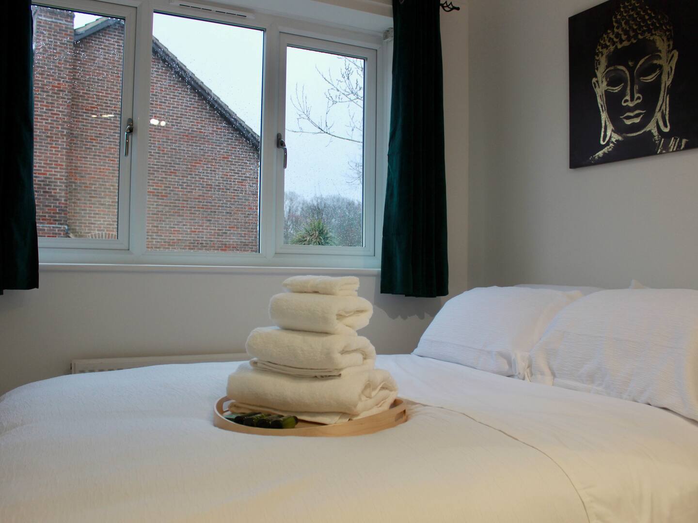 Spacious bathroom with bath and shower in Three Bridges accommodation